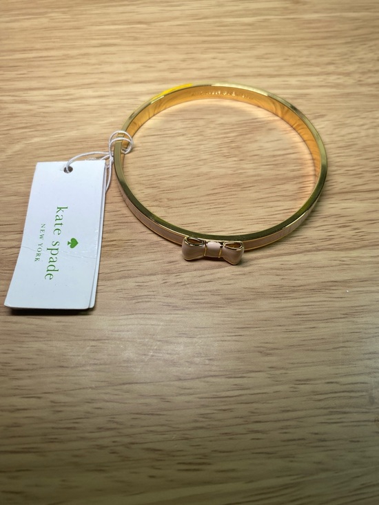 kate spade Jewelry - kate spade gold bangle with blush pink bow charm